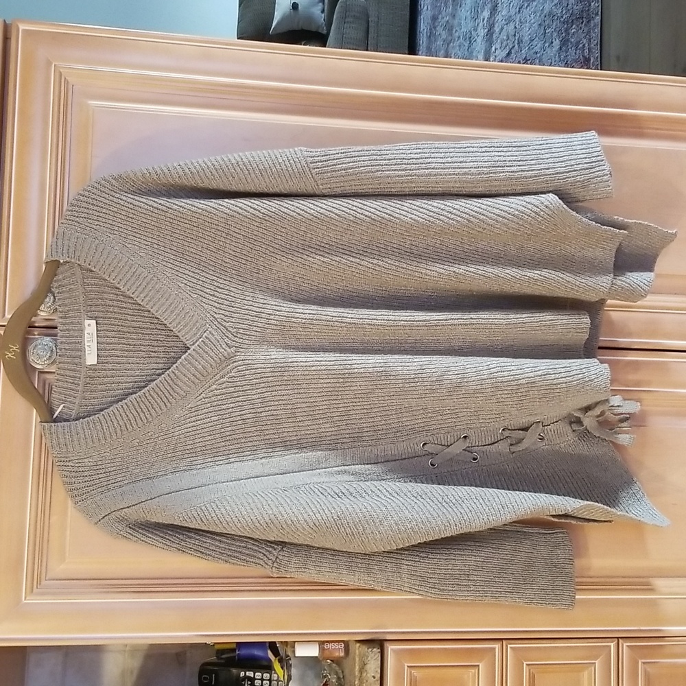 Illa Illa brand 100% acrylic sweater . With detailed braiding in front.